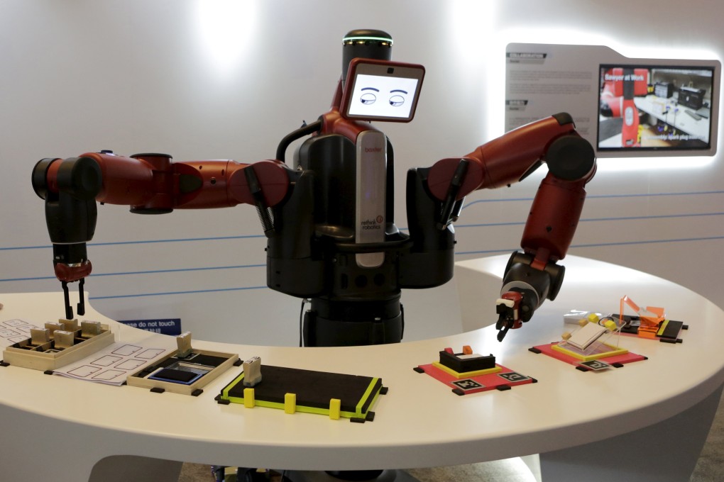 A Baxter robot from US-based Rethink Robotics picks up a business card at the recently held World Economic Forum in China's port city of Dalian in northern Liaoning province. Robotic innovations in Hong Kong are no less impressive. Photo: Reuters