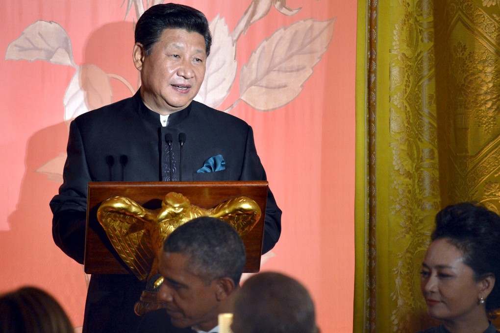 Chinese President Xi Jinping speaks as his wife Madame Peng Liyuan and US President Barack Obama listen during a state dinner at the White House in Washington on Friday. Photo: Reuters