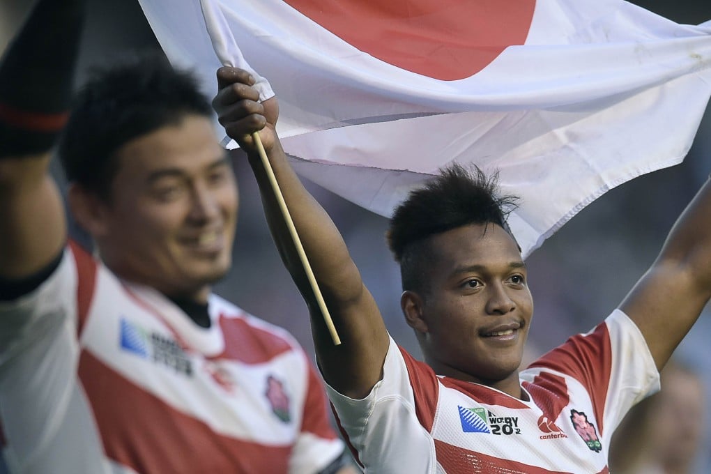 Japan's wing Kotaro Matsushima (right) celebrates their pool B win over two-time champions South Africa at the Brighton Community Stadium.  Japan won 34-32. Photo: AFP