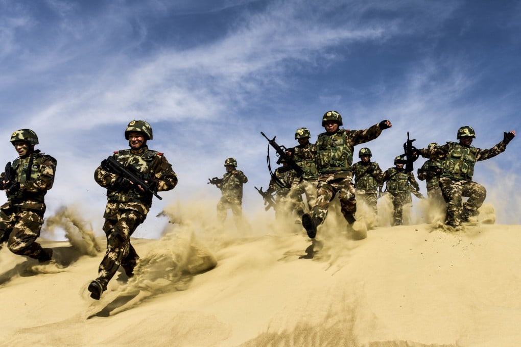 Chinese soldiers attend a drill in the border city of Jeminay, northwest China's Xinjiang Uygur Autonomous Region, on April 24. Photo: Xinhua