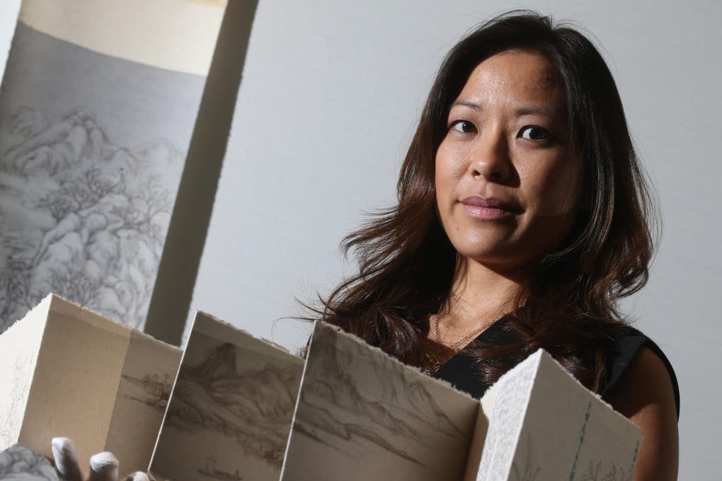 Katherine Don of Sotheby's shows ink artworks by Peng Wei. Photo: K.Y. Cheng