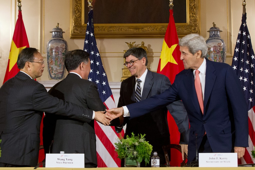 (From left) China's State Councilor Yang Jiechi, China's Vice Premier Wang Yang, Secretary of Treasury Jack Lew and Secretary of State John Kerry shake hands following the conclusion of the US China Closing Statements at US China Strategic and Economic Dialogue at the US State Department in Washington. Photo: AP