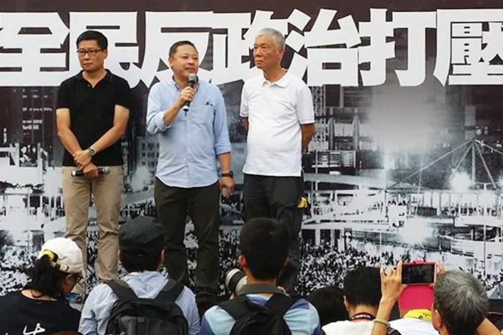 The Occupy Central trio of (from left) Dr Chan Kin-man, Benny Tai and the Reverend Chu Yiu-ming address the crowds on stage in Admiralty. Photo: SCMP Picture