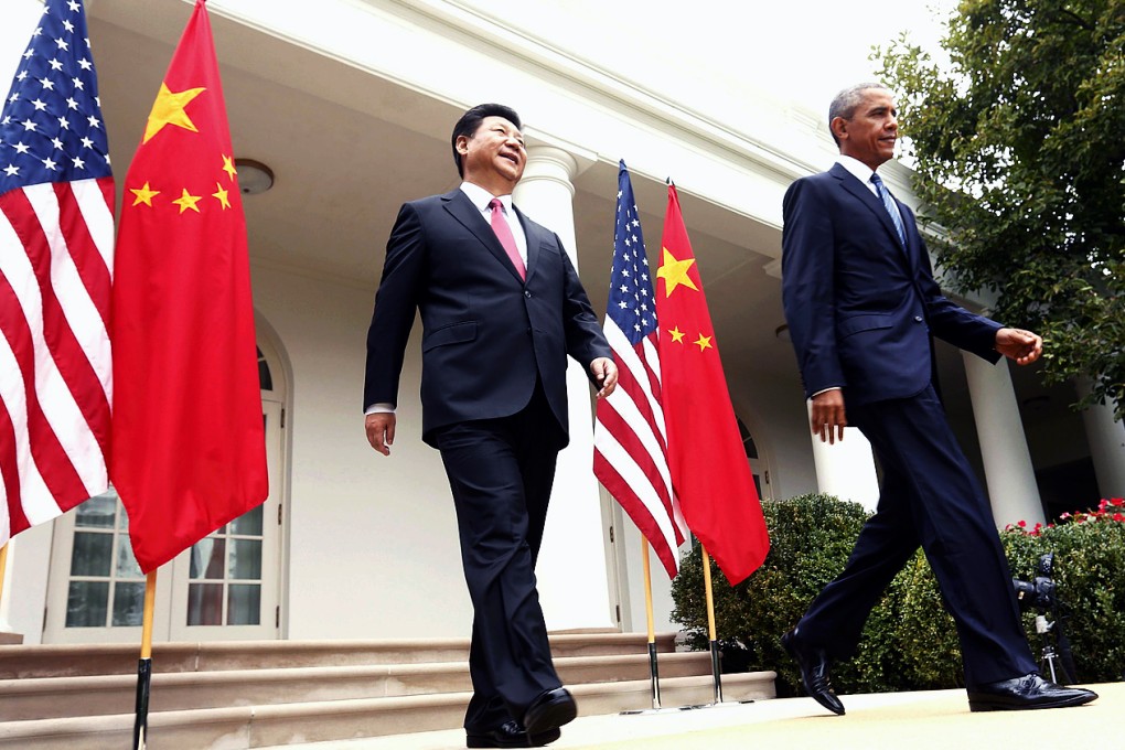 US President Barack Obama (right) and Chinese President Xi Jinping hold a joint news conference at the White House. Photo: Reuters