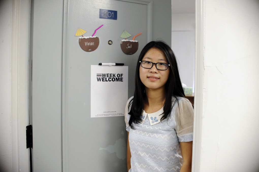 University of Connecticut sophomore, Anyi Yang of Beijing, poses outside her dorm room. Photo: AP