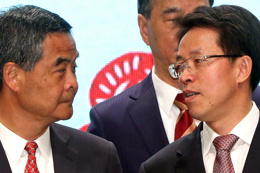 The poll was conducted by the university's Institute of Asia-Pacific Studies from Monday to Thursday last week, just over a week after Zhang Xiaoming (right), director of Beijing's liaison office, said the chief executive was in a "special legal position that transcended" the executive, the legislature and the judiciary. Chief Executive Leung Chun-ying scored 40.1 out of 100 overall on his performance, down from 42.7 last month. Photo: Felix Wong