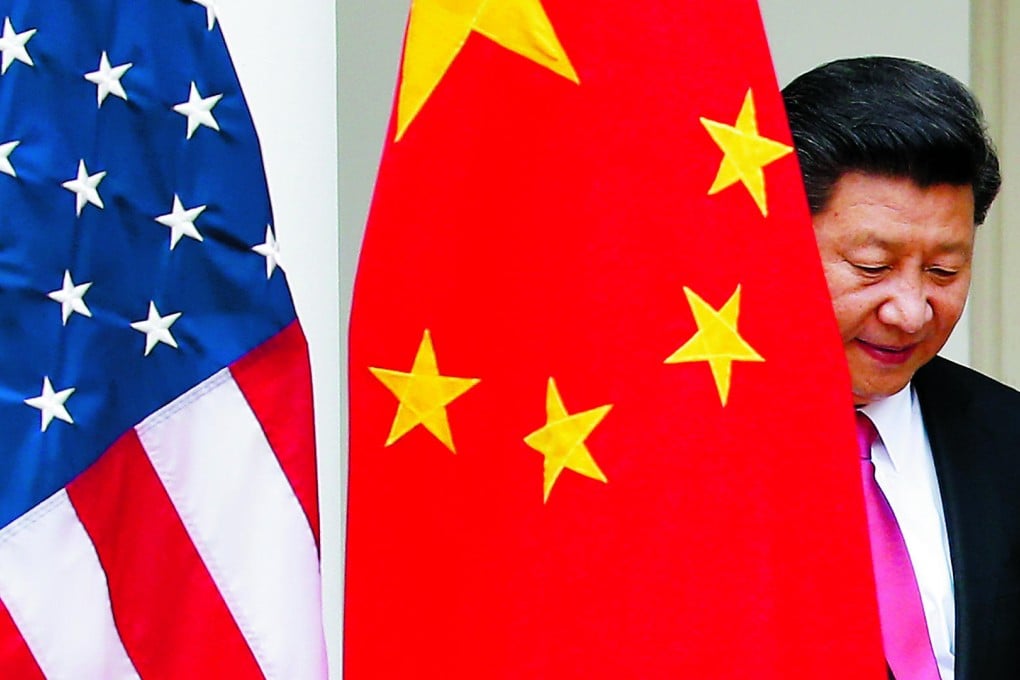 President Xi Jinping steps out from behind a Chinese flag as he takes his position for his joint news conference with President Barack Obama. Photo: AP