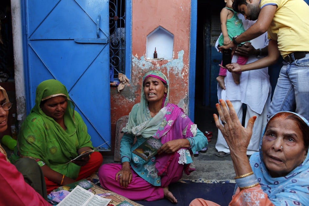 Relatives mourn the killing of 52-year-old Muslim farmer Mohammad Akhlaq at his home in Bisara. Photo: AP
