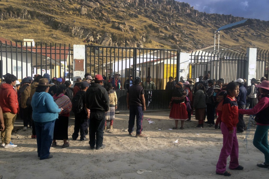 People protest in front of the Las Bambas mine where a clash between police and locals left four people dead.  Photo: AFP