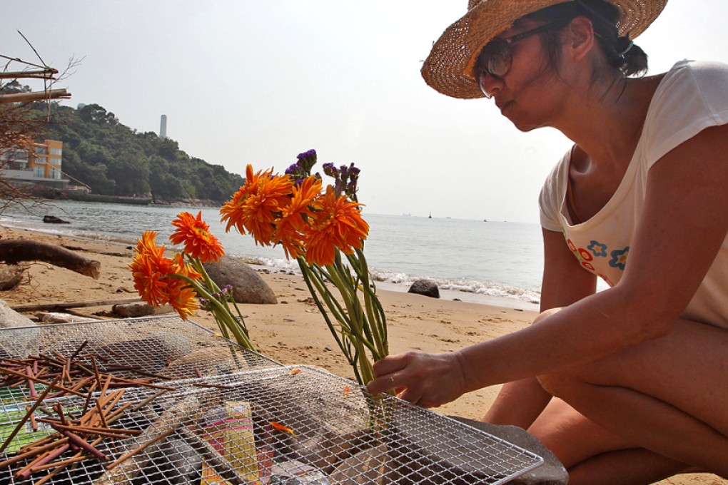 Followers of Tibertan Buddhism offered flowers in a religious ritual on Lamma Island on the first anniversary of Lamma ferry collision tragedy two years ago. Photo: Felix Wong