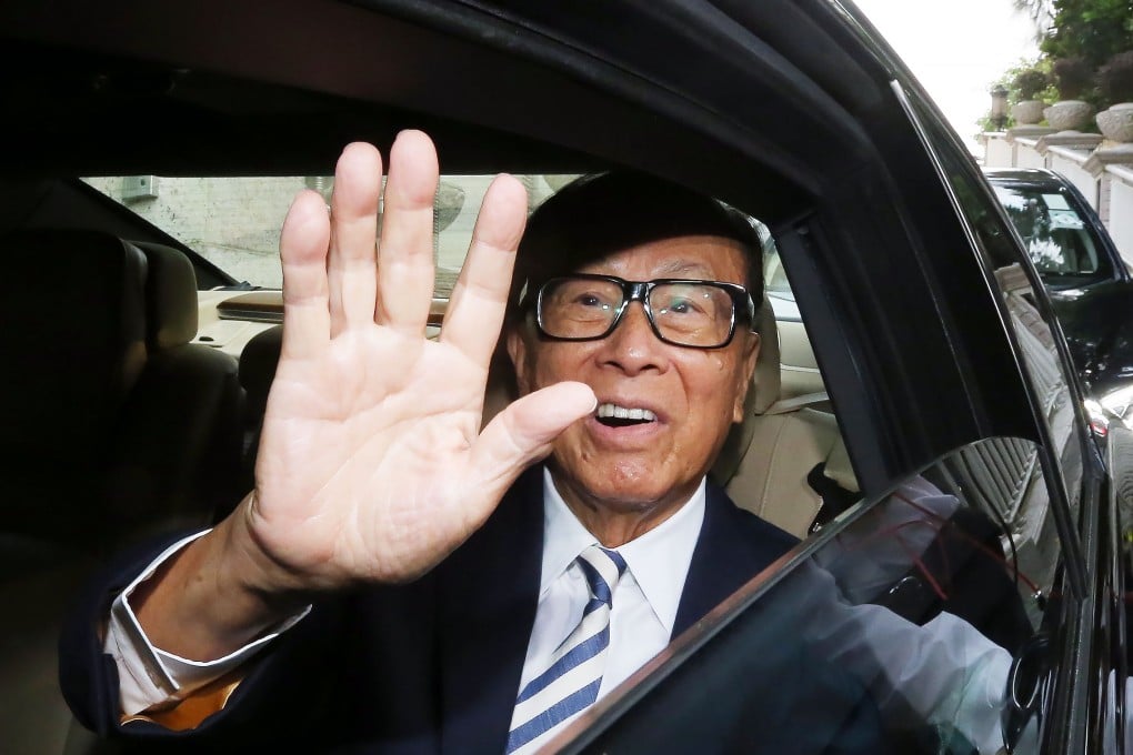 Li exiting his home on Wednesday morning at Hong Kong's Deep Water Bay. Photo: David Wong