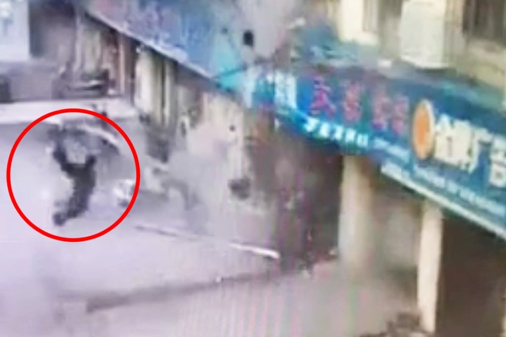 This screen grab from Weibo shows what appears to be a person catapulted out of a store during one of the explosions on Wednesday. Photo: SCMP Pictures