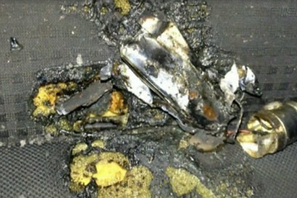 The aftermath of the exploding battery is seen on the burnt car seat upholstery.  Photo: CBS