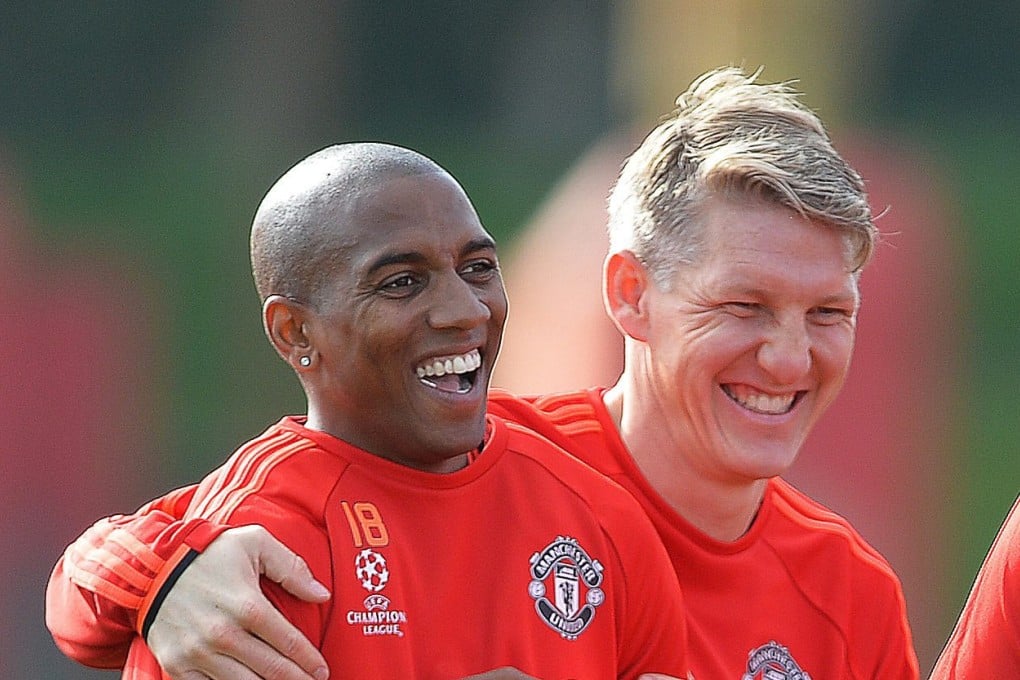 Ashley Young jokes in training. Photo: AP