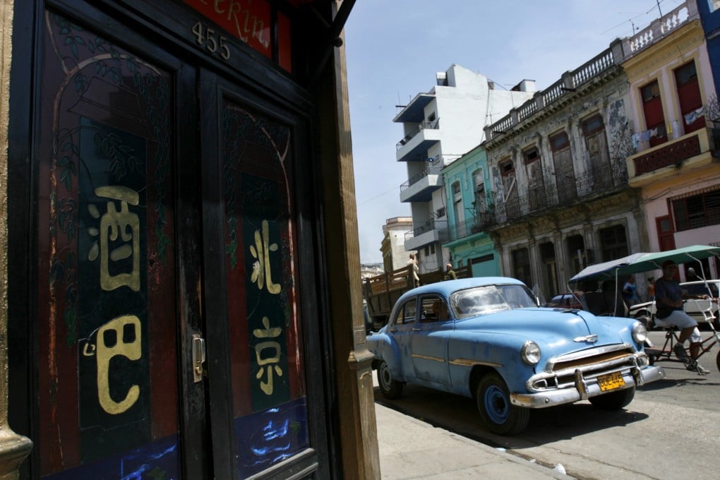 A vintage car parked outside the Beijing Bar in Havana's Chinatown. Photo: Reuters
