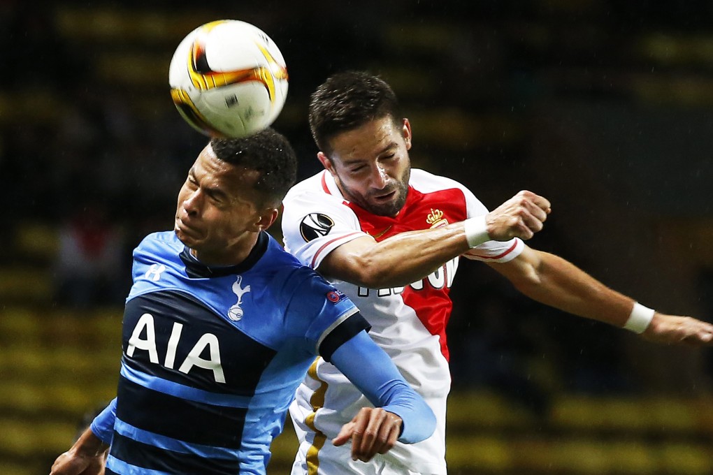 Spurs' Dele Alli (L) in action against Joao Moutinho. Photo: EPA