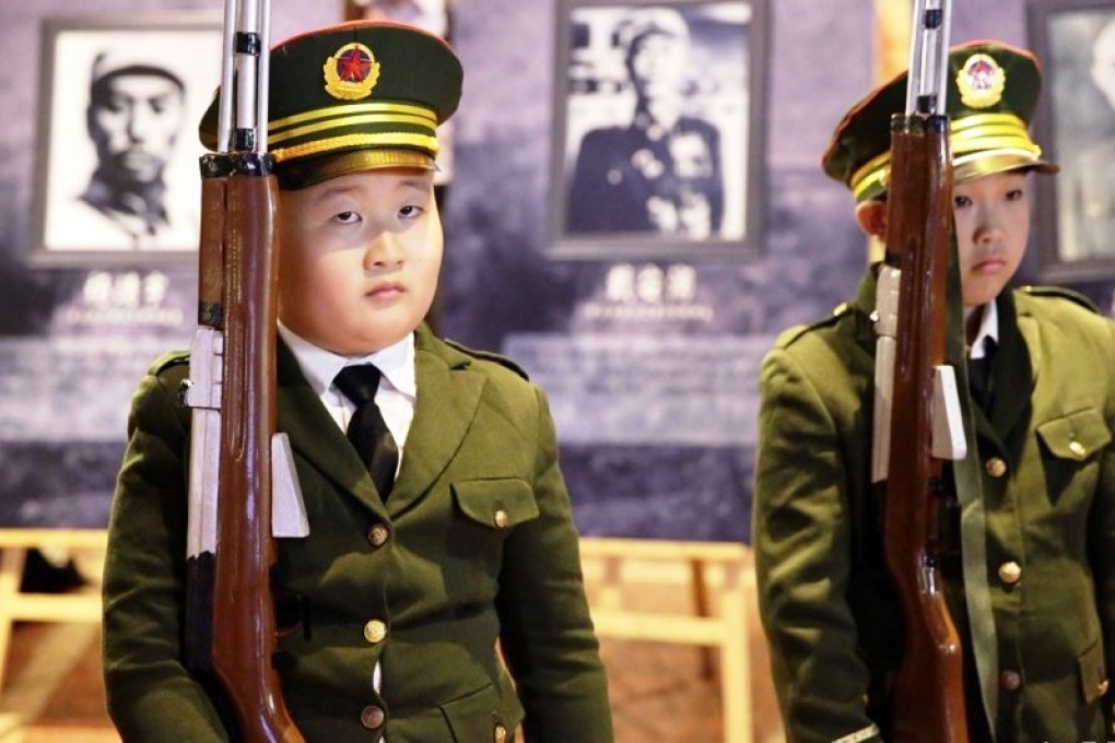 Children stand to attention in a National Day parade at a Beijing shopping mall on Thursday. Photo: SCMPPictures