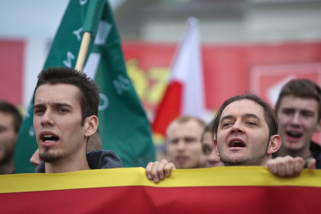 Polish youth in Warsaw protest against the acceptance of 7,000 refugees in Poland, a decision imposed by the European Union. Photo: EPA