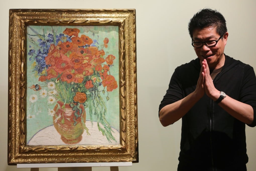 Wang Zhongjun stands next to his prized van Gogh painting. Photo: Sam Tsang