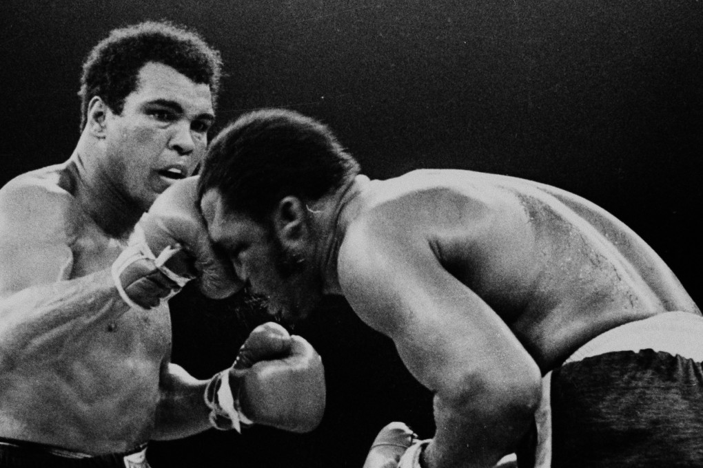 Muhammad Ali throws a right at Joe Frazier in the 13th round of their fight. Photos: AP