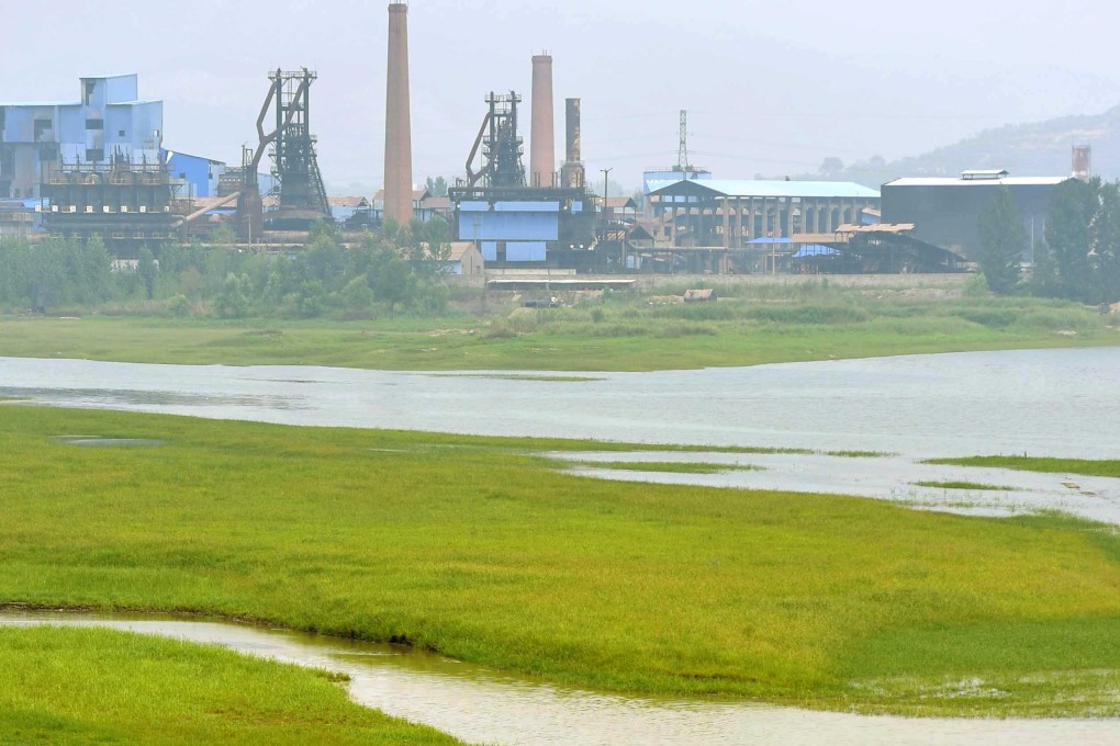 An iron and steel factory is just located in the middle of the Luan River. About 30 per cent of the country's major rivers are polluted or severely polluted. Photo: Xinhua