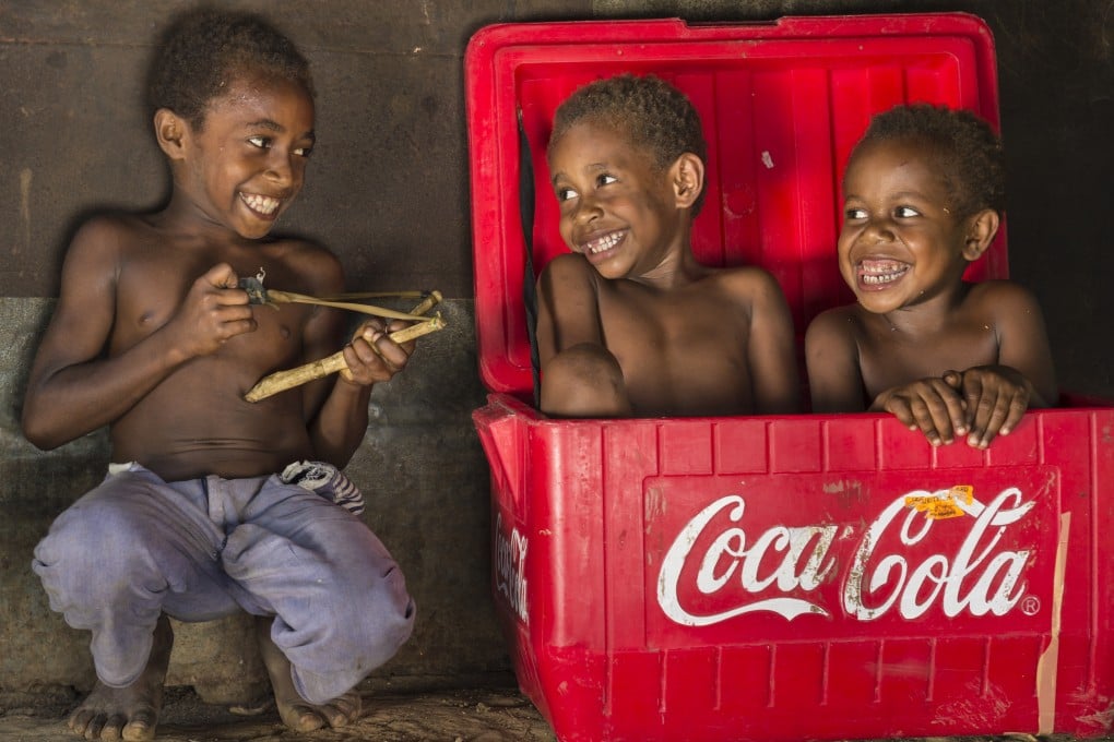 Children from the Baining tribe of Papua New Guinea, which is credited with giving a name to the feeling of emptiness we experience when guests depart. Photo: Corbis