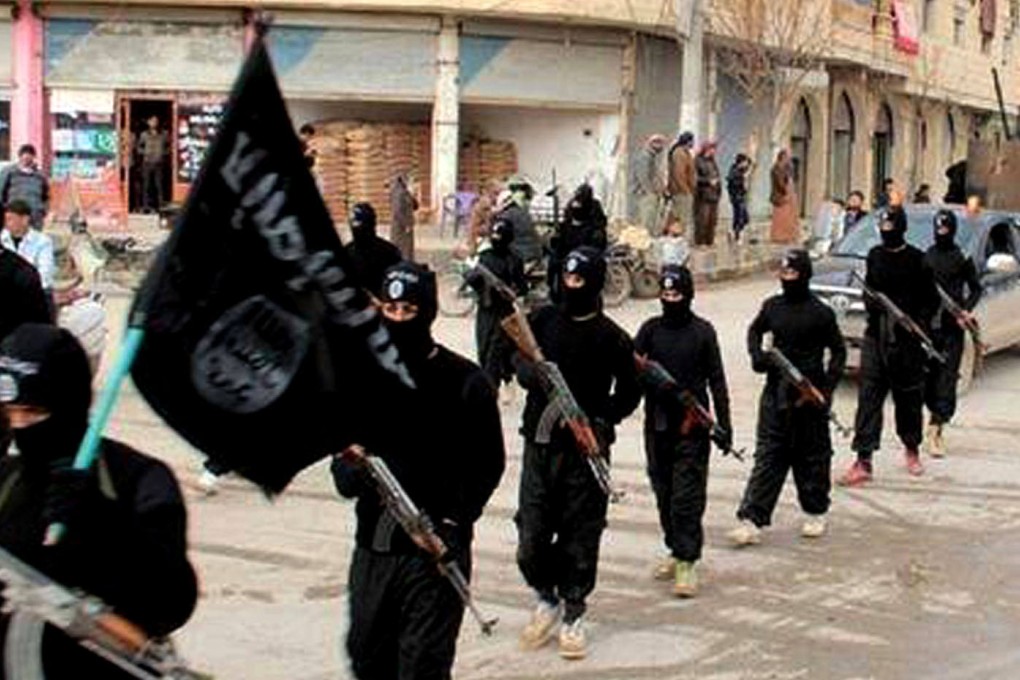Islamic State fighters parading through Raqqa in Syria in January 2014. Photo: AP