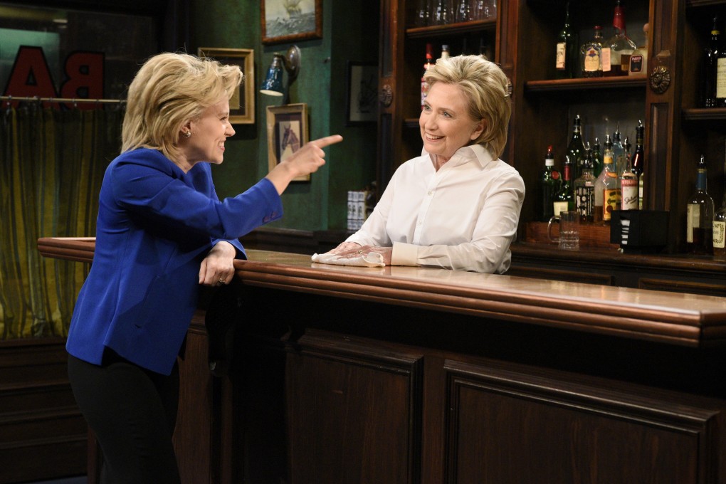 Clinton played Val, a bartender, who poured a drink for none other than Hillary Clinton played by Kate McKinnon.