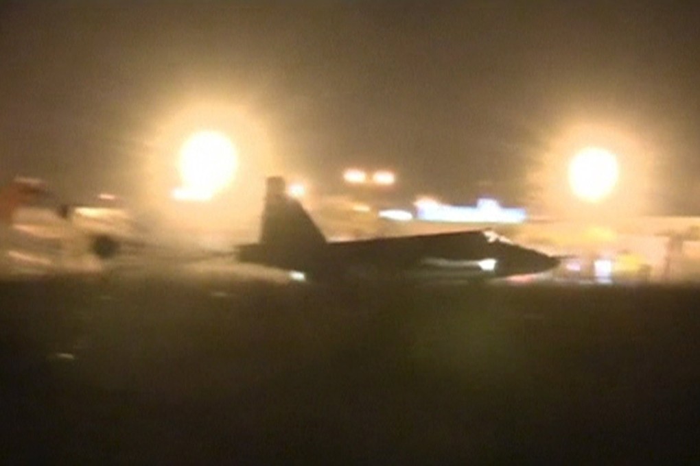 A Russian military jet taxis on a runway shortly after the landing in Syria.  Photo: Reuters