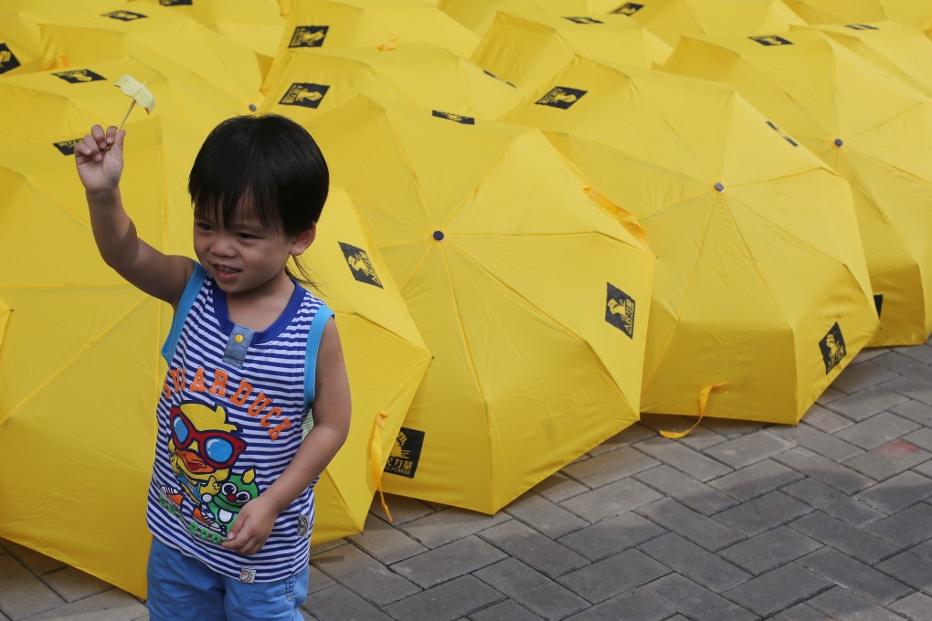 Yellow umbrellas displayed outside government headquarters in Admiralty during the Occupy anniversary. Photo: Sam Tsang
