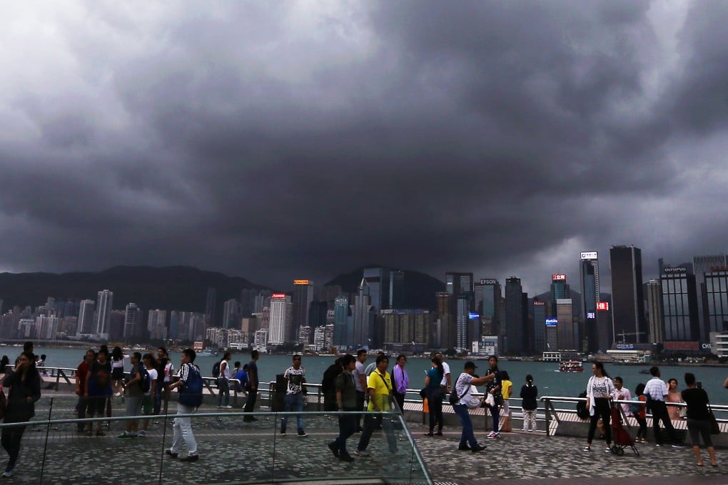 Dark clouds hang over Victoria Harbour as Typhoon Mujigae closes in on Hong Kong on Sunday evening. Photo: Sam Tsang