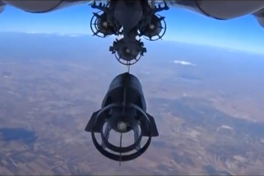 Bombs are dropped during an air strike against what Russia says was a large concentration of Islamic State military equipment. Photo: EPA