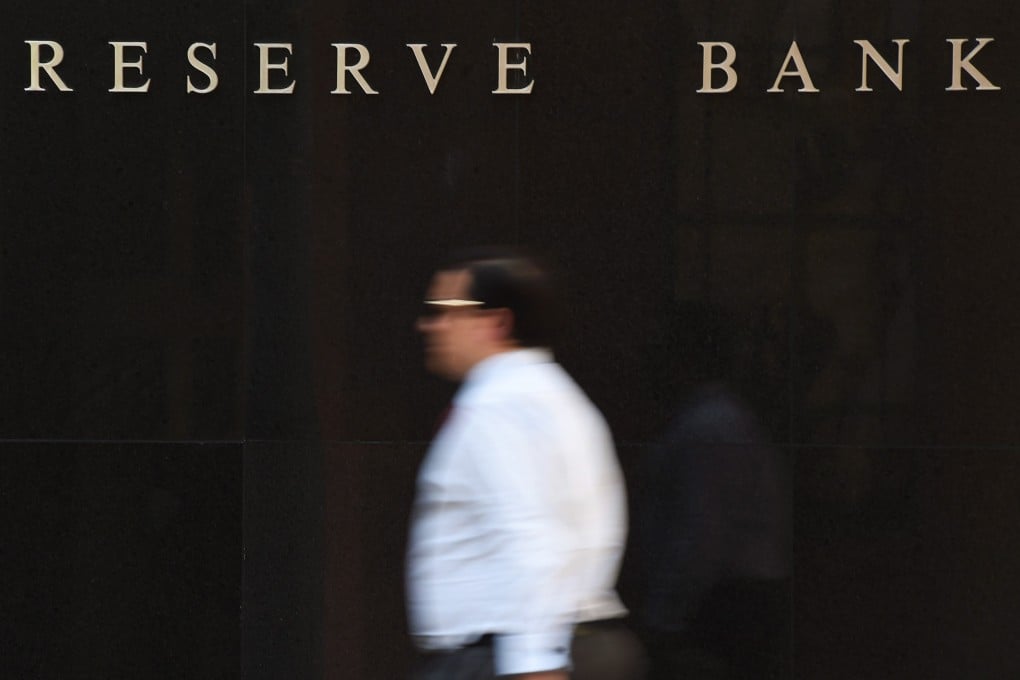 A pedestrian walks past the Reserve Bank of Australia (RBA) building in Sydney, Australia, which kept rates steady for a fifth month running. Photo: EPA