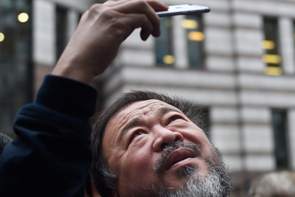 Ai Weiwei takes a selfie in London. He only recently got his passport back.