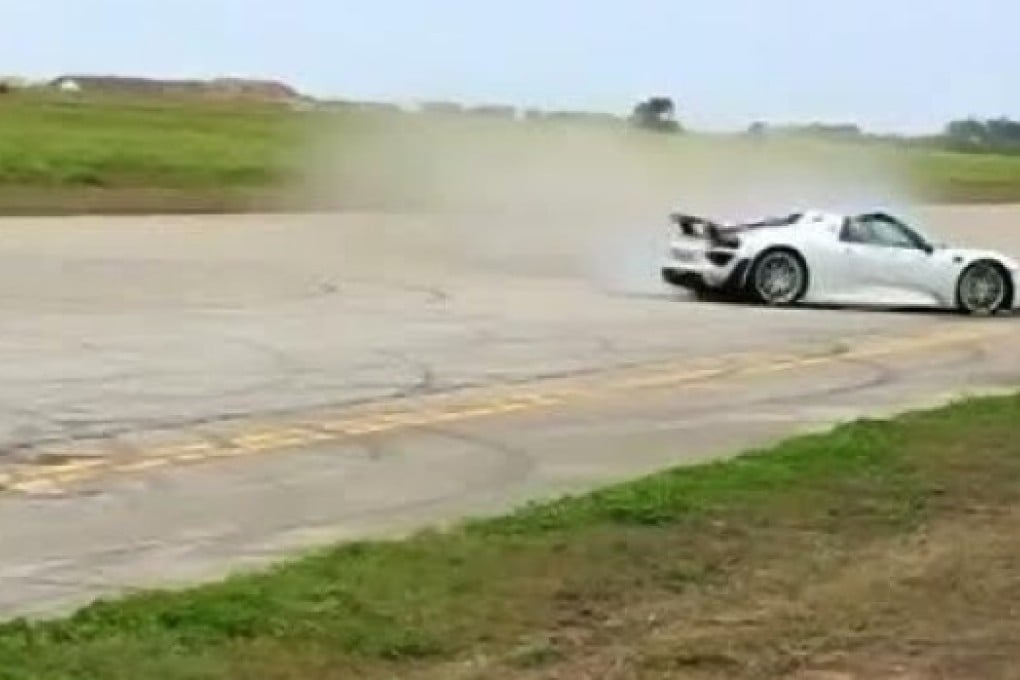 Paul Bailey's Porsche spins out of control moment before crashing into a crowd of spectators.  Photo: Reuters