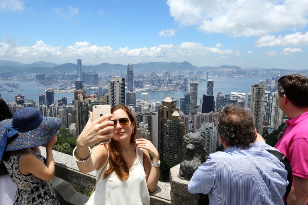 Tourists on The Peak enjoy the hot and dry September weather