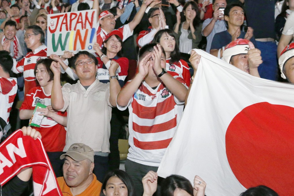 Fans in Tokyo celebrate during a live screening of the Samoa game. Photos: Kyodo