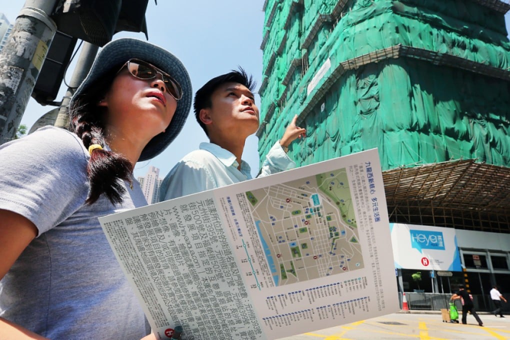 Potential buyers wait outside a sales office in Hong Kong last month. Photo: Edward Wong
