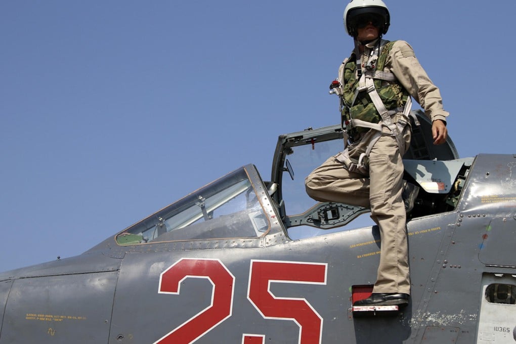 A Russian army pilot with a SU-25M jet fighter at Hmeimim airbase in Syria. Photo: AP