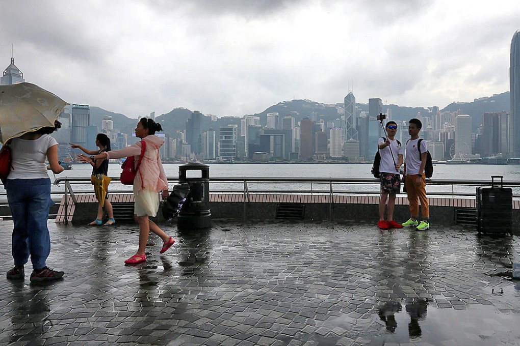 Tourists on the Tsim Sha Tsui harbourfront on National Day. The number of inbound tourists climbed 3.4 per cent year on year between October 1 and 5. Photo: David Wong