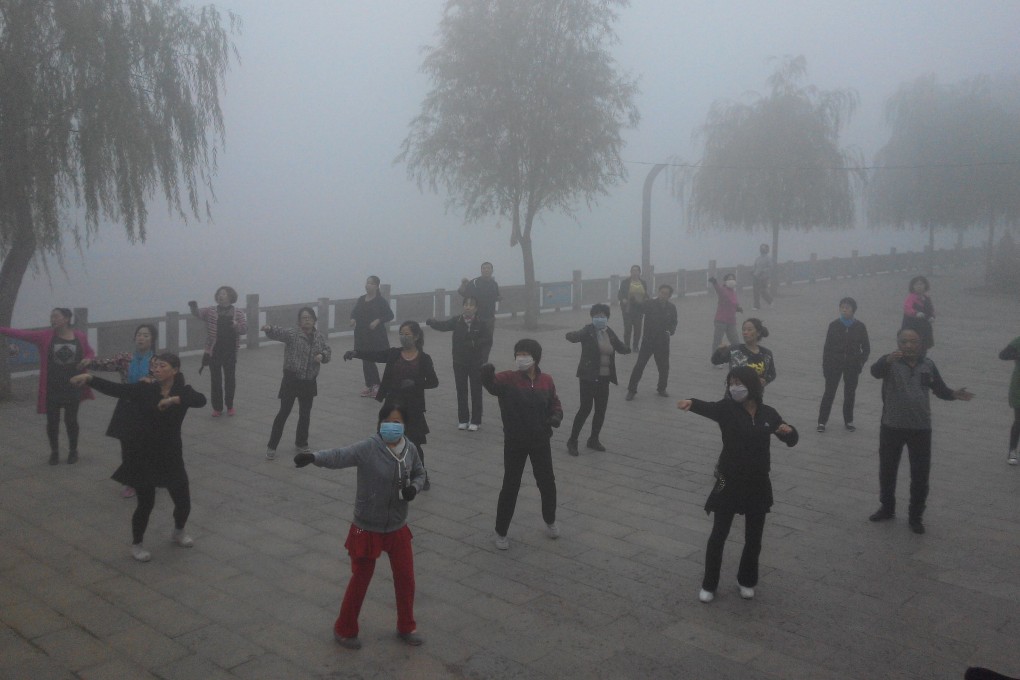 Tai chi practitioners don masks for their early morning exercise in Pingquan county, Hebei province on Tuesday. Photo: Xinhua