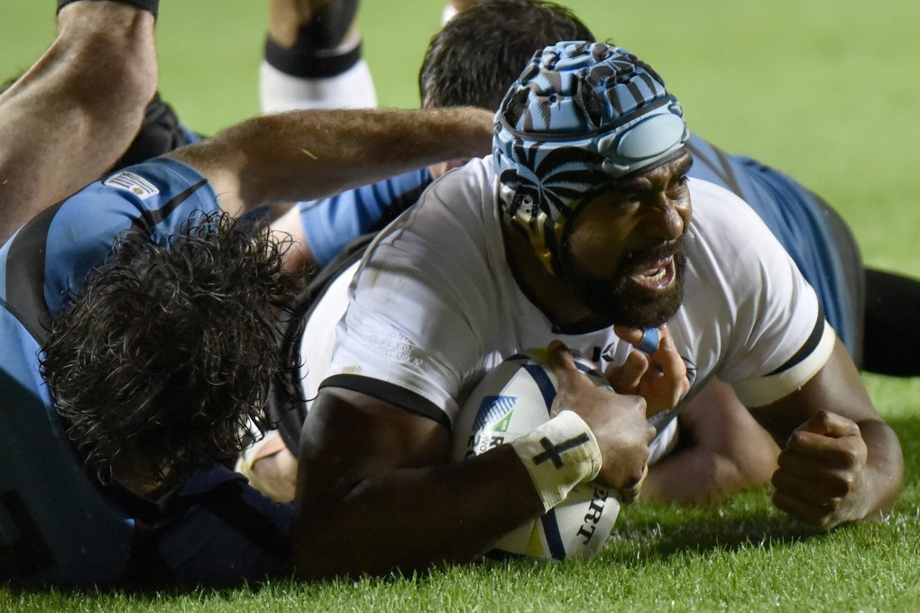 Tevaita Cavubati scores for Fiji during their 47-15 win over Uruguay on Tuesday. Photo: EPA