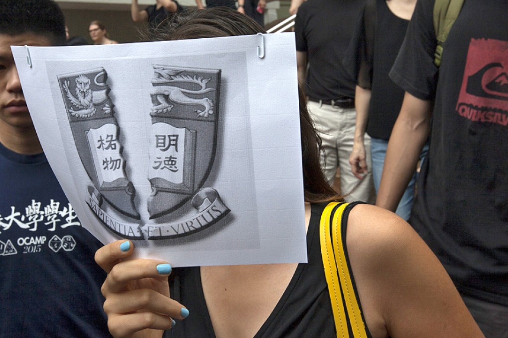 Students, faculty members and staff protested in a 'silent march' yesterday through the HKU campus against what they perceive to be interference in the university's autonomy. Photo: EPA