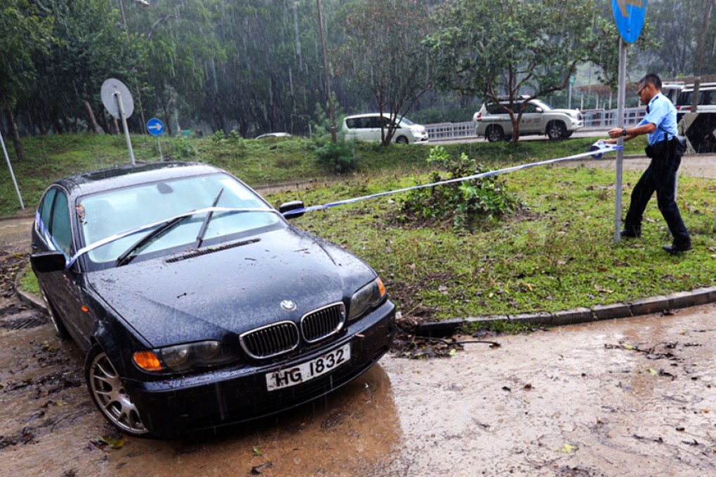 This car was engulfed in rain water at a roundabout near the entrance to Sai Kung Country Park. Photo: Dickson Lee