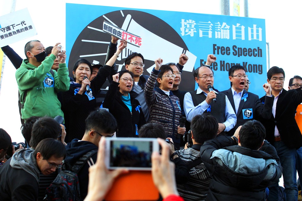 Members of The Hong Kong Journalists Association and supporters march to Chief Executive's office from Charter Garden to protest against diminishing press freedom in 2014. Photo: Felix Wong