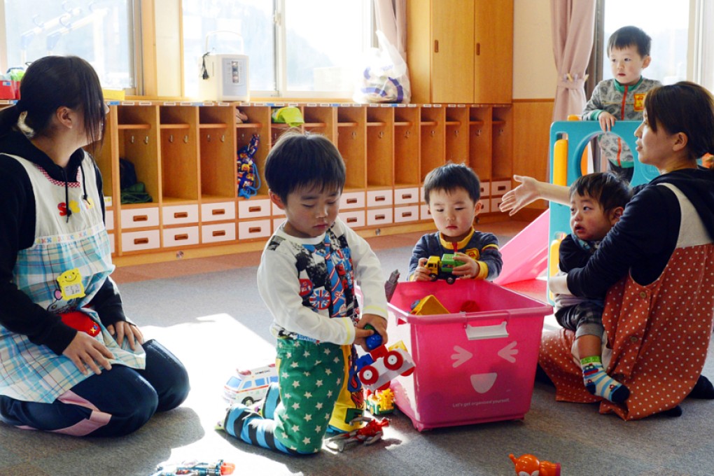Toddlers play at a nursery school in Tamura, Fukushima Prefecture, after authorities allowed residents to return to their homes within the 20km evacuation zone. Photo: AP
