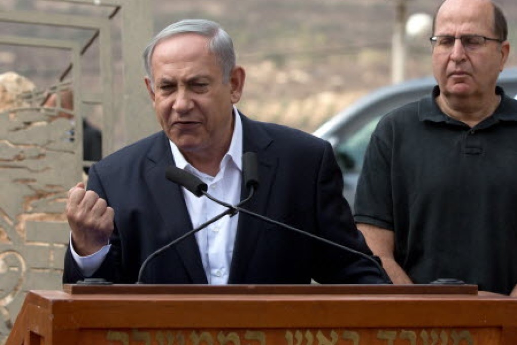 Netanyahu tells his people to maintain 'determination, responsibility and unity' to overcome terror wave. Photo: AFP