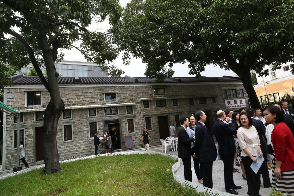 Guests attend the opening ceremony of the Stone Houses Family Garden in Kowloon City yesterday.Photos: Jonathan Wong