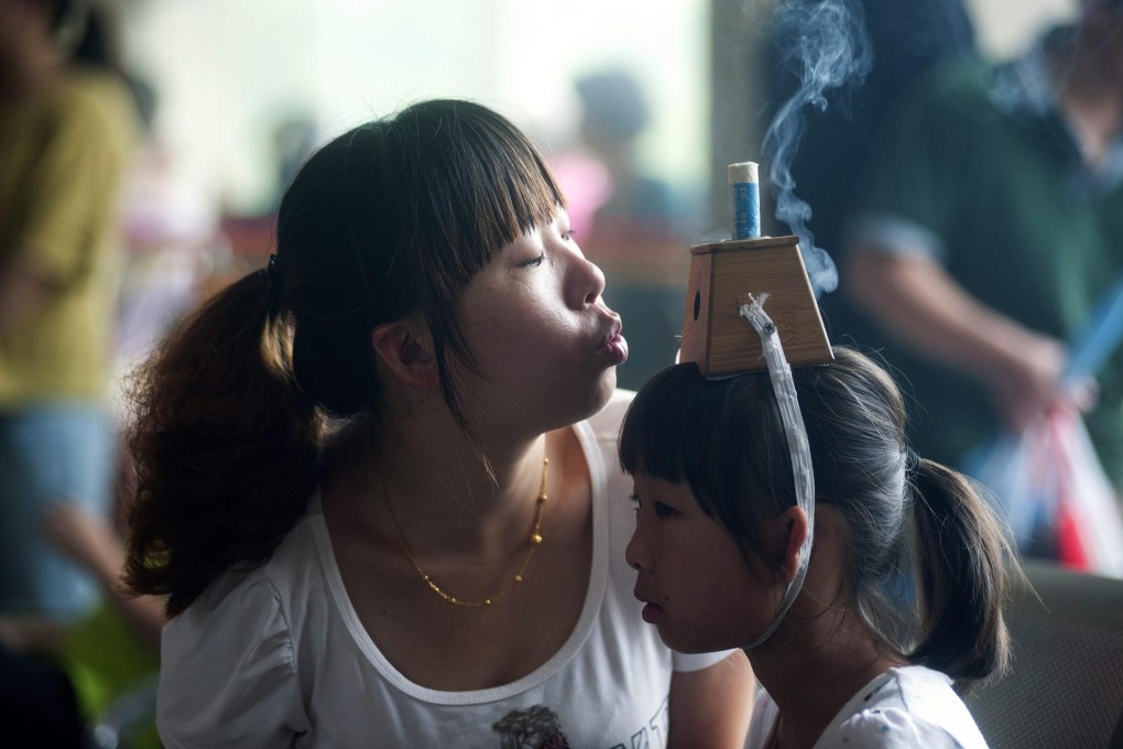 Moxibustion therapy is said to enhance immunity.Photo: EPA