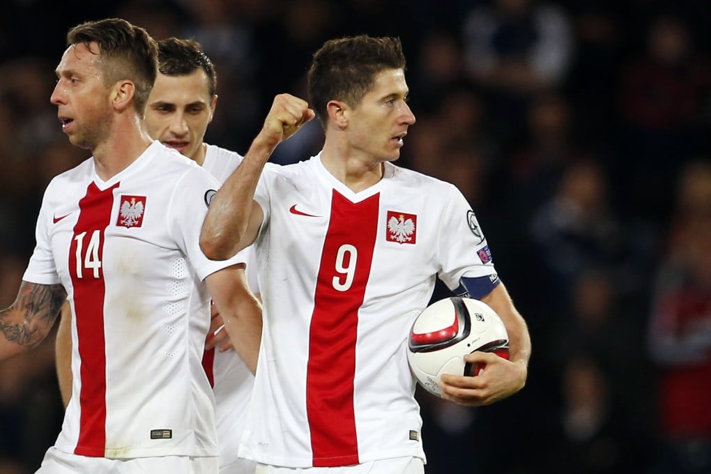 Robert Lewandowski celebrates after scoring the second goal for Poland, who are the top scorers in group A. Photo: Reuters
